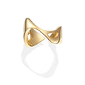 Front view of sculptural open gold ring with curved band and angular cutout tips, on white background
