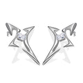 Pair of futuristic silver earrings with angular star-shaped design and emerald-cut zircon center, placed on white background

