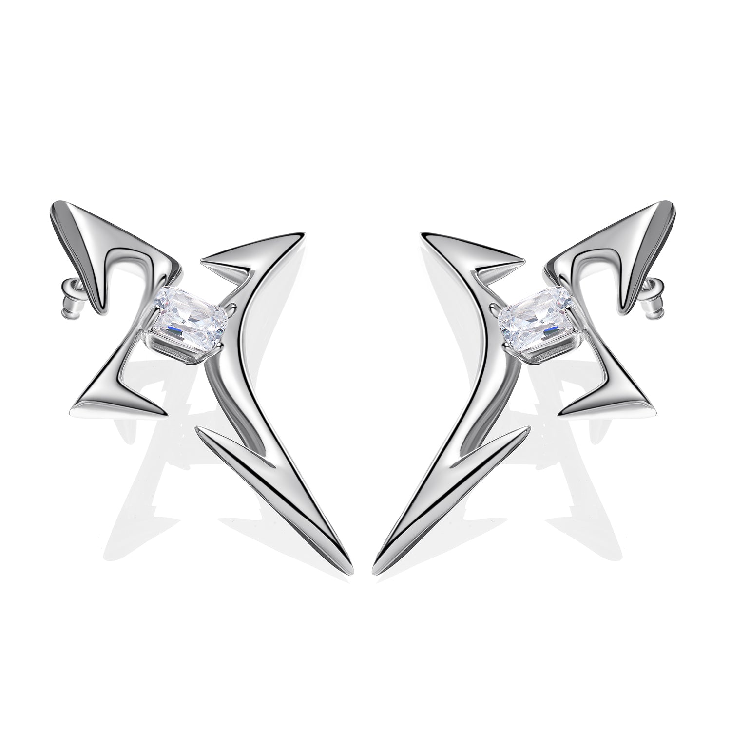 Pair of futuristic silver earrings with angular star-shaped design and emerald-cut zircon center, placed on white background

