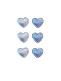Holographic heart-shaped acne patches in pearlescent blue finish

