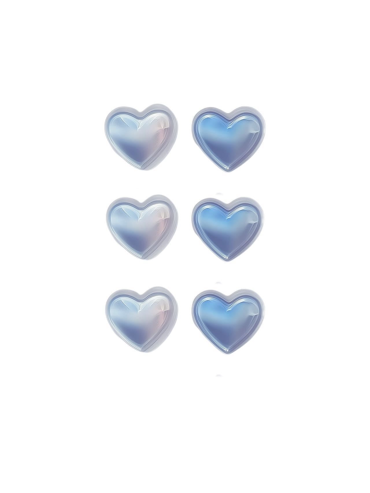 Holographic heart-shaped acne patches in pearlescent blue finish

