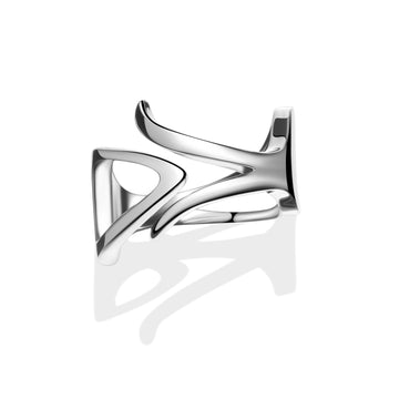 Close-up of a futuristic sterling silver ring with sculptural curves and a fluid, reversible design, displayed against a white background.
