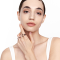 Model wearing two Pioneer Rings in 925 sterling silver, styled on adjacent fingers to highlight their geometric, sculptural design.