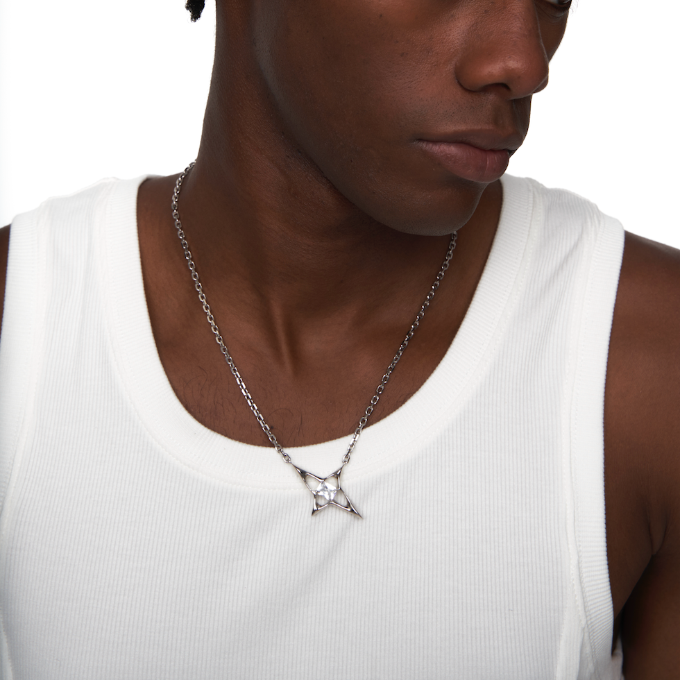 Male model wearing the Star Silver Geometric Necklace in a white tank top, styled with a clean and minimalist look.
